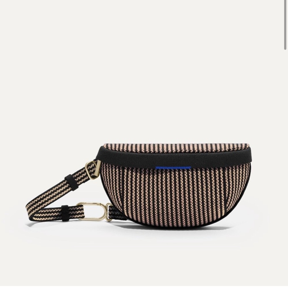 Rothy's Black and Tan Sling Bag with Textile Texture.